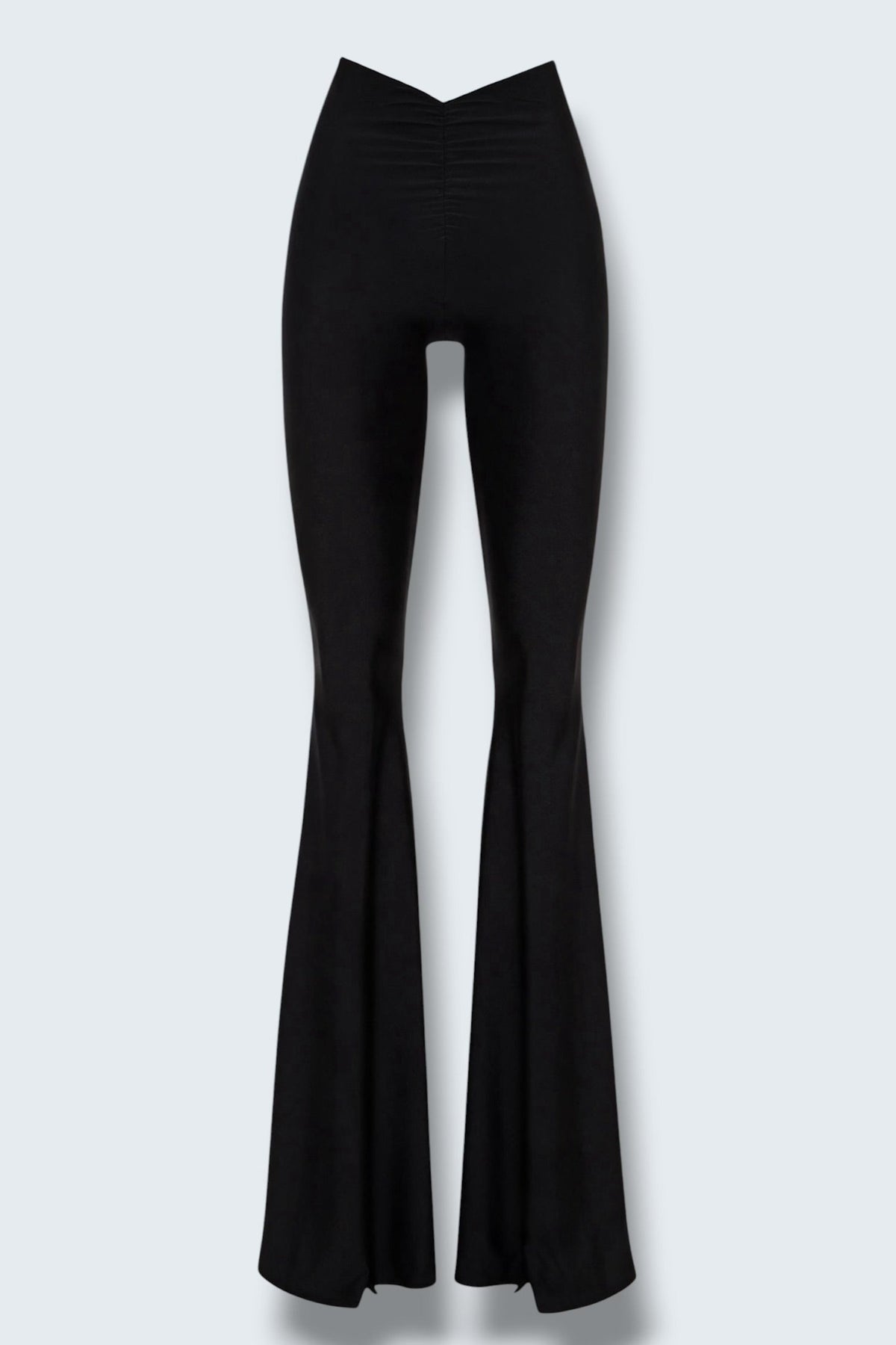 The Saint 54 Muse trousers in black stretch fabric with a high waist, flared legs, and inner seam slits.