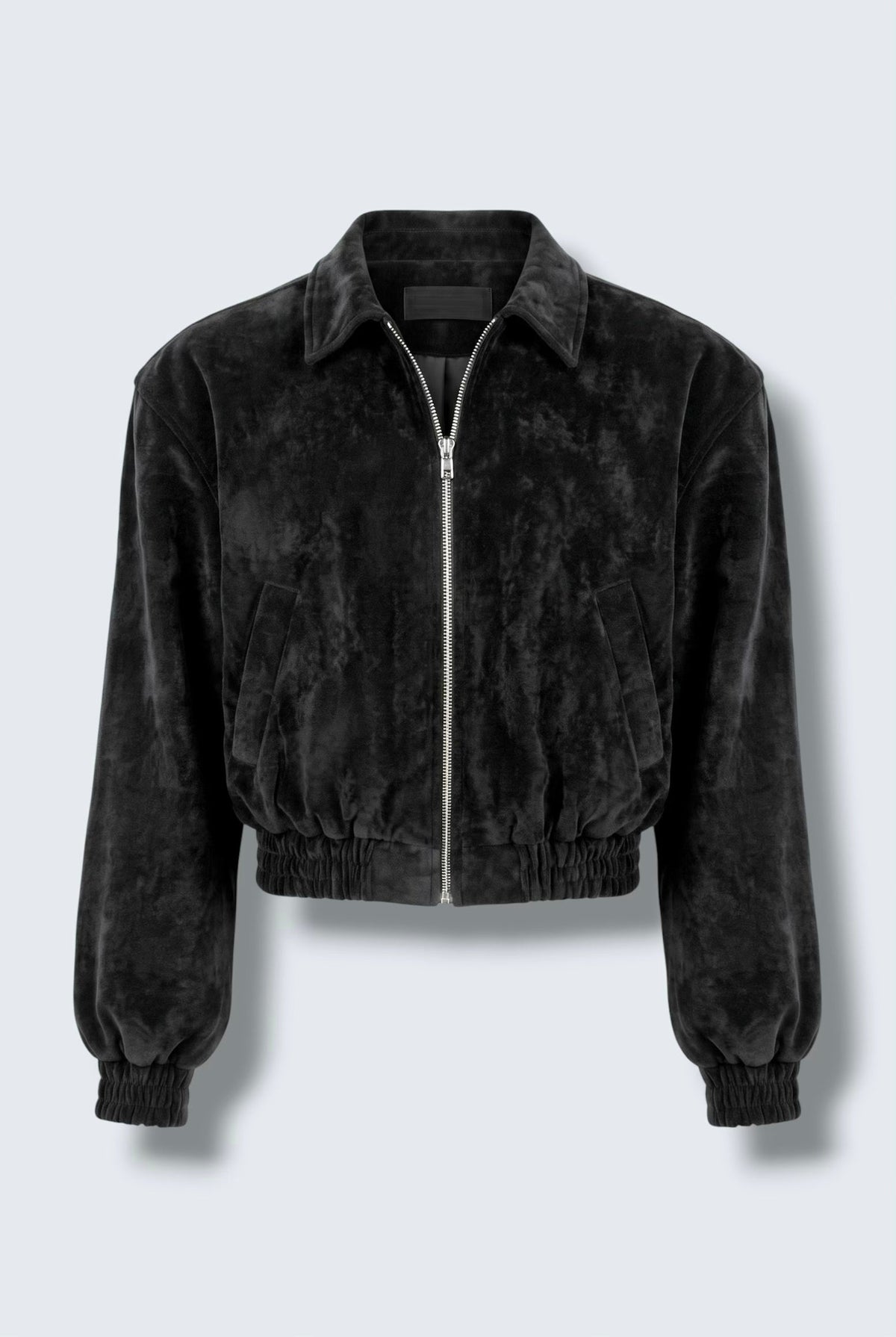 The Saint 54 black suede bomber jacket with an oversize fit, shoulder pads, and satin lining worn by a model.