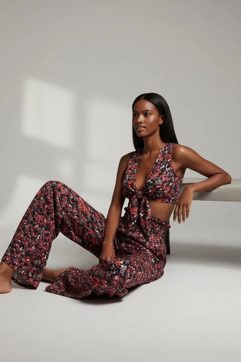 The Saint 54 floral print vest and wide-leg trouser set with a tie-front top and high-waisted loose-fit pants.