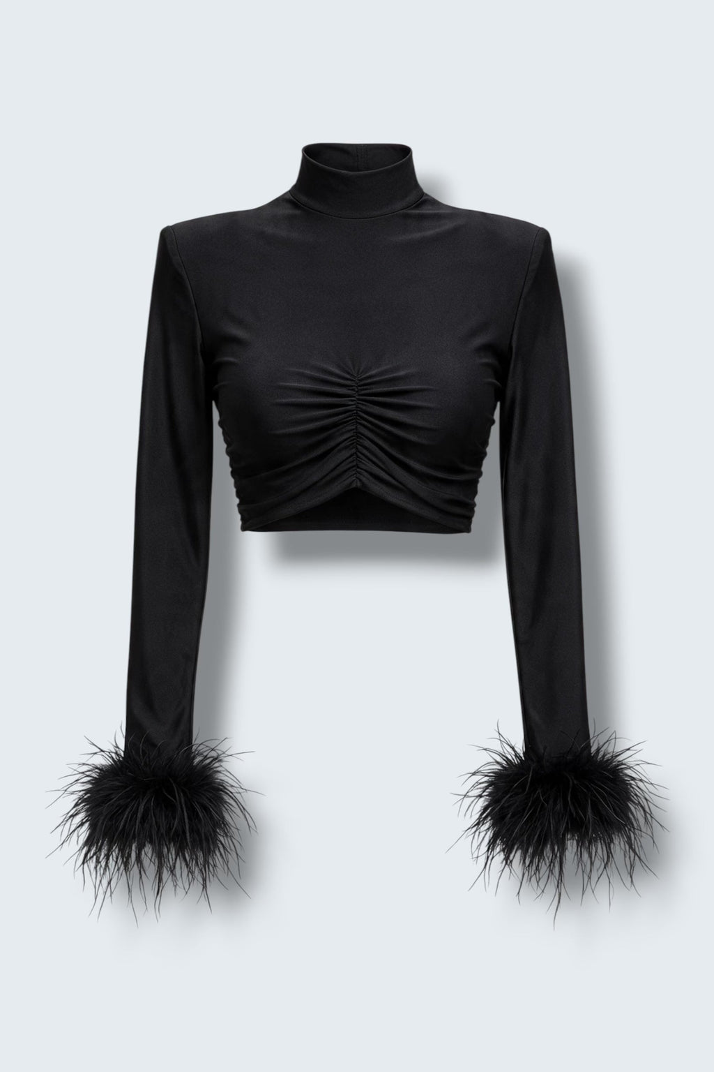 The Saint 54 Miss Rose black long-sleeve crop top featuring elegant ostrich feather cuffs on a model