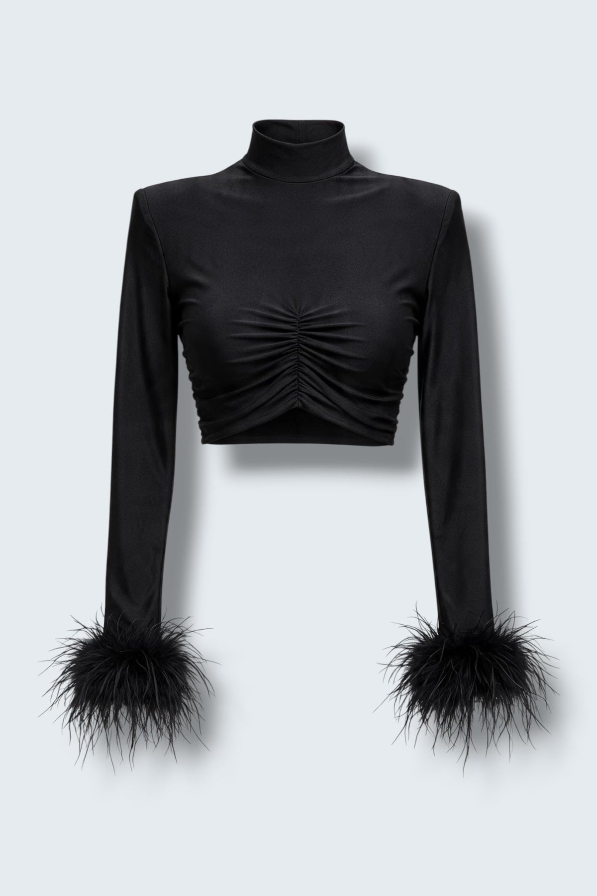 The Saint 54 Miss Rose black long-sleeve crop top featuring elegant ostrich feather cuffs on a model