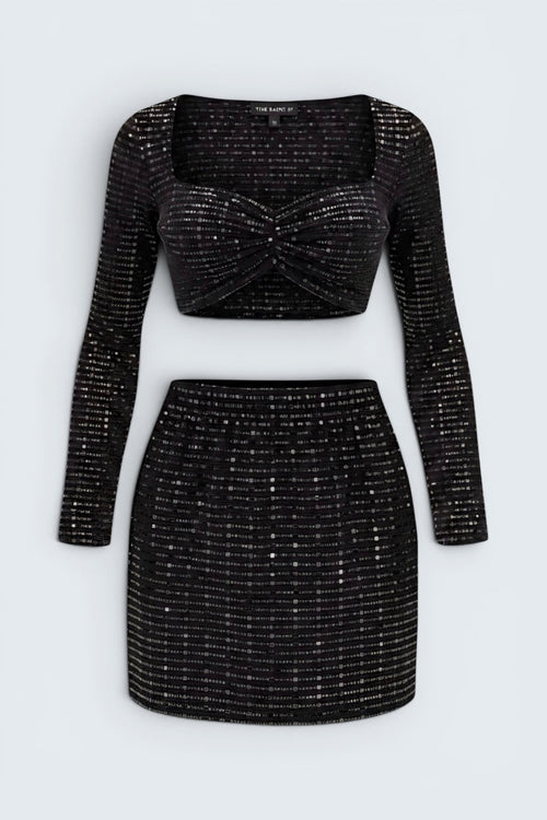 The Saint 54 Set Glamour black long-sleeve cropped top and matching mini skirt in textured sequin stretch fabric.